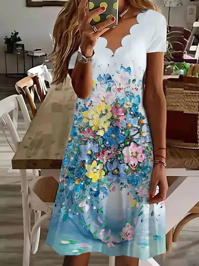 Flattering women's floral flared midi dress with a scalloped edge, suitable for elegant spring and autumn occasions.