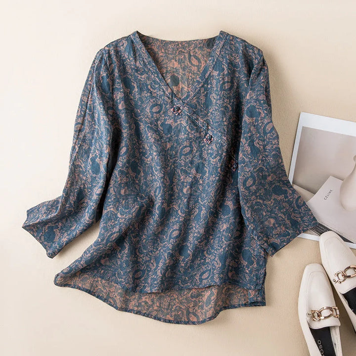 Women's floral print relaxed fit shirt with button-front, V-neck, and 3/4 sleeves for casual summer wear.