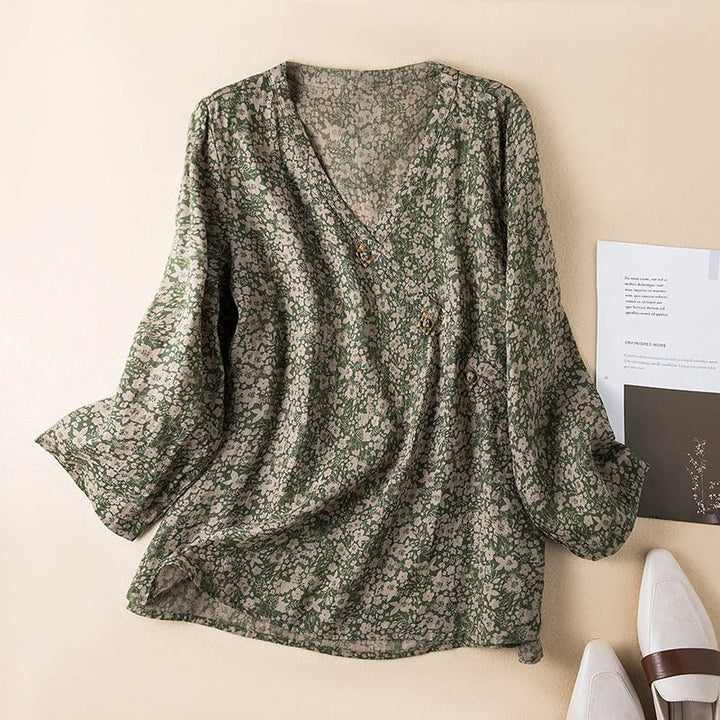 Versatile women's floral print 3/4 sleeve shirt. A relaxed V-neck button-front blouse perfect for summer fashion.