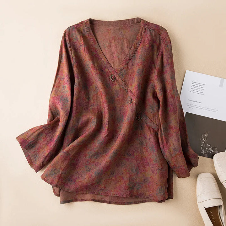 Everyday casual women's top: stylish floral print, 3/4 sleeve, V-neck, and button-front. Relaxed fit for comfort.