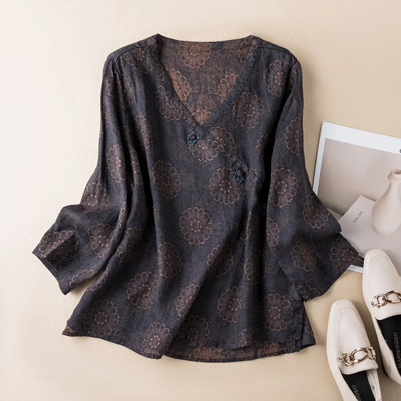 Trendy women's floral print shirt. Relaxed fit, V-neck, 3/4 sleeve, and button-front design for versatile styling.