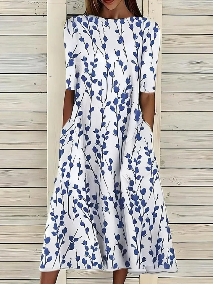 Women's floral print short sleeve midi dress with a flattering A-line swing skirt, perfect for summer casual wear.