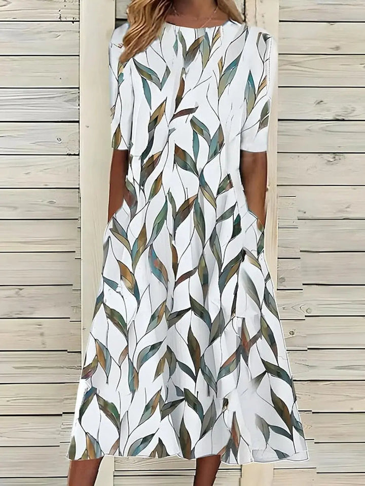 Vibrant floral print short sleeve midi dress for women, ideal for garden parties & summer casual events.