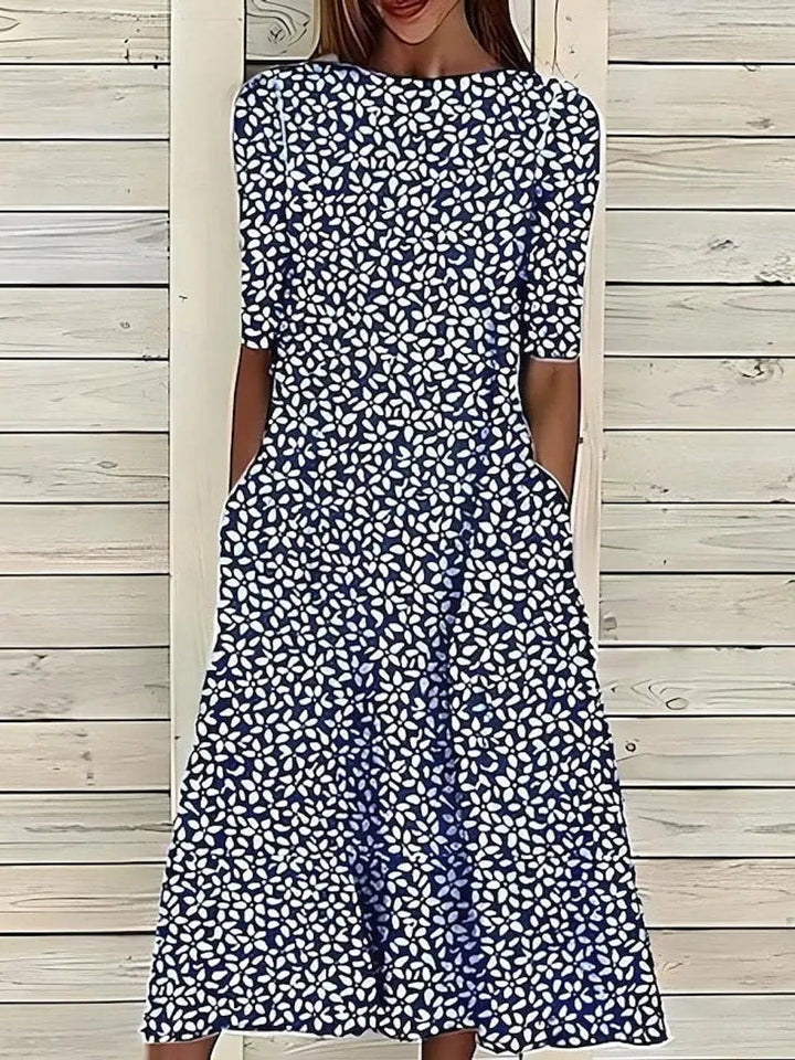 Stylish women's A-line swing midi dress with a beautiful floral print and comfortable short sleeves.