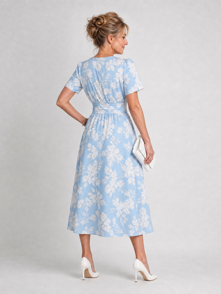 Vibrant floral print V-neck short sleeve midi dress, a chic choice for spring and summer style.