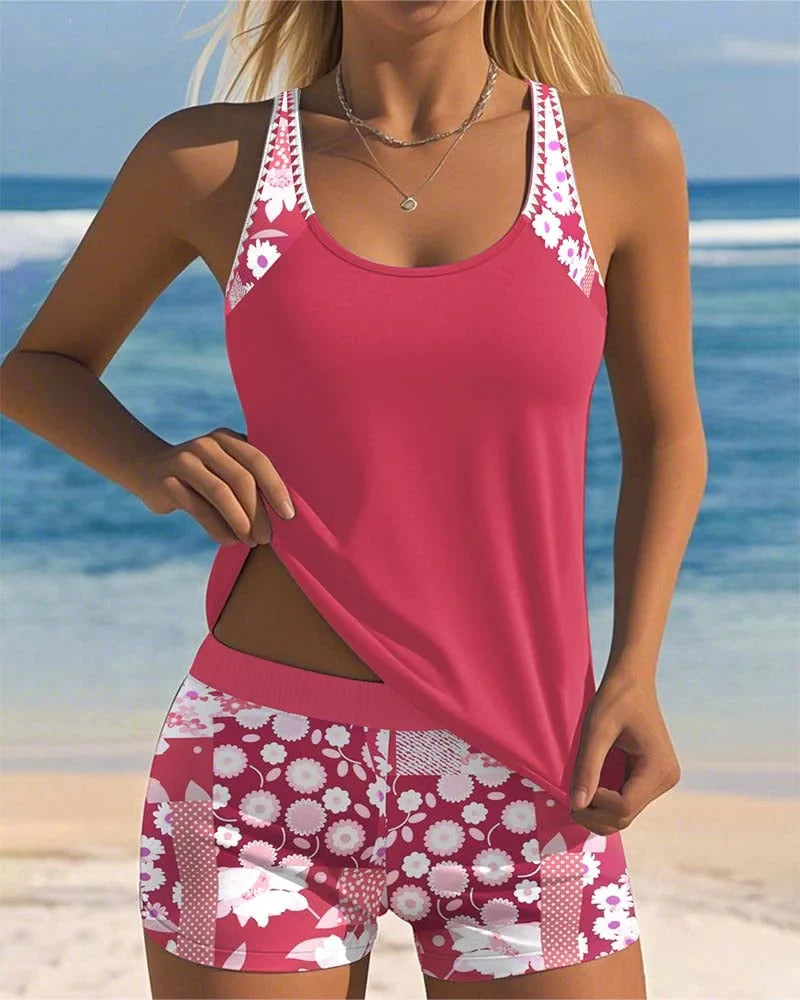 Women's floral print tankini swimsuit set with black shorts. Beach-ready summer fashion.