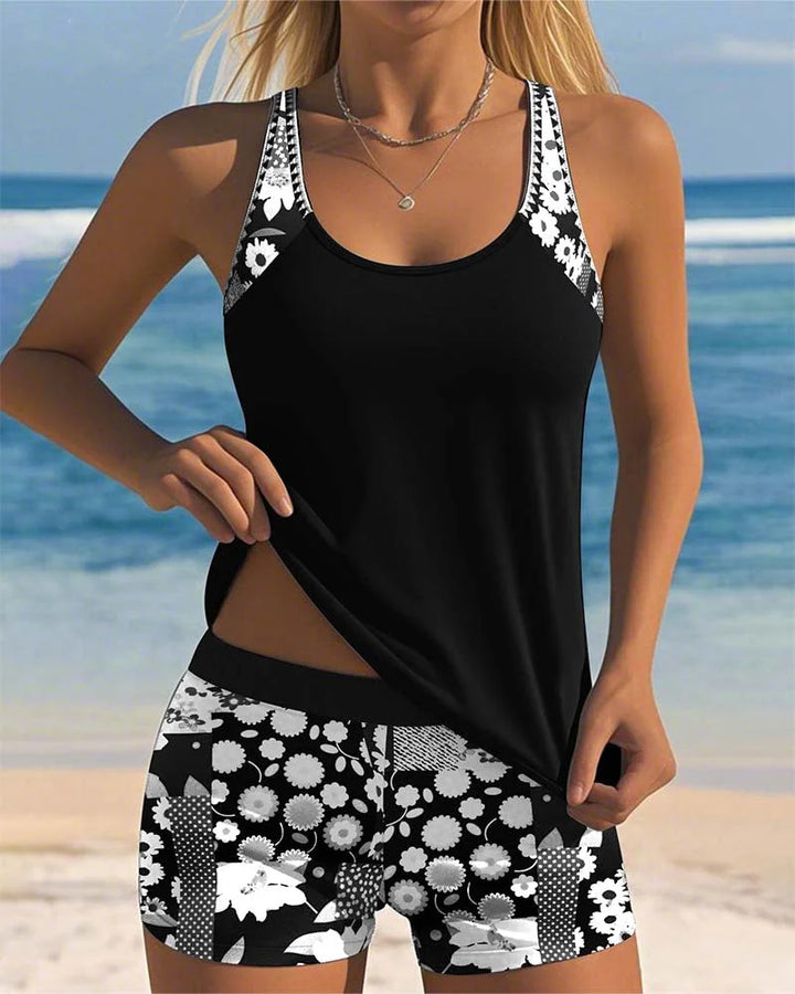Two-piece women's floral tankini swimsuit with comfortable black shorts. Perfect beachwear.