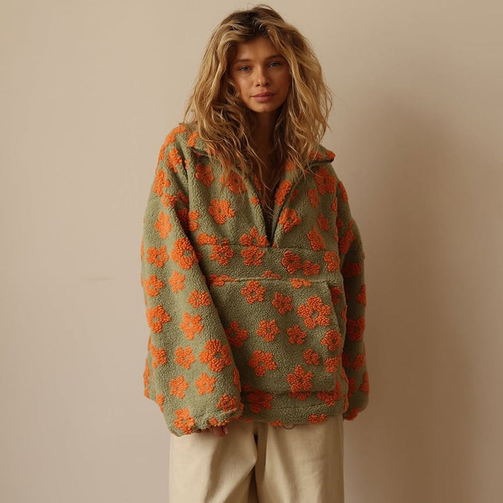Model in comfortable women's relaxed fit floral quarter zip sweater, perfect for casual outings.
