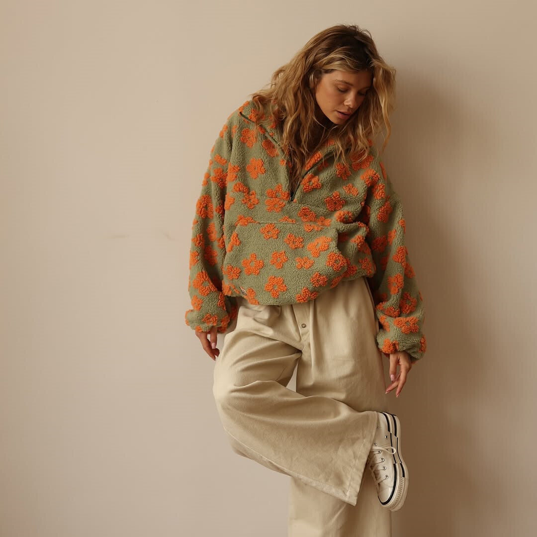 Soft women's floral print quarter zip sweater with a relaxed fit, a cozy long sleeve pullover.