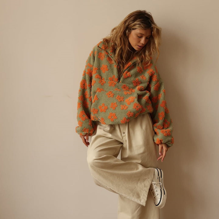 Soft women's floral print quarter zip sweater with a relaxed fit, a cozy long sleeve pullover.