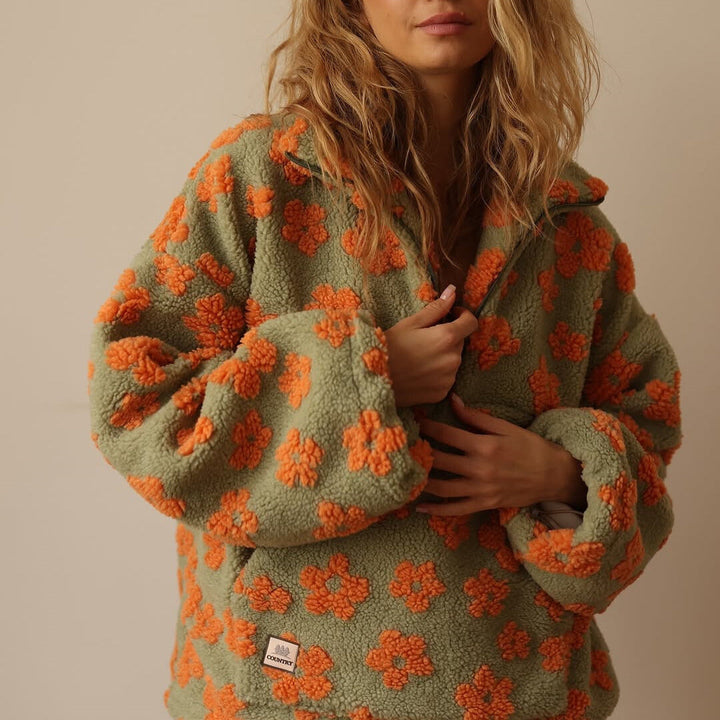Women's fall fashion floral quarter zip sweater; relaxed fit, long sleeve pullover for cozy comfort.