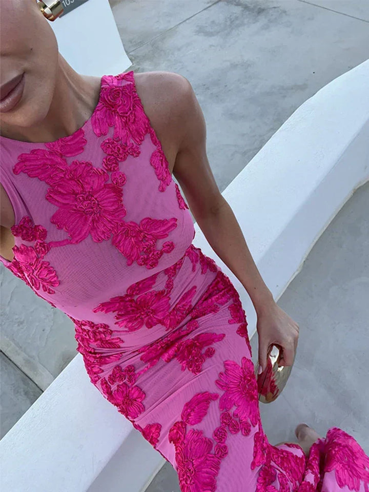 Fitted women's pink floral sleeveless maxi dress, elegant occasion wear for warm weather style.