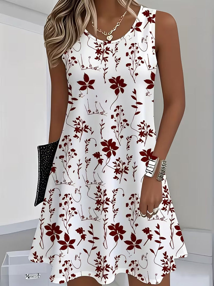 Effortless women's floral mini dress, sleeveless and flowy, a perfect casual summer or vacation outfit.