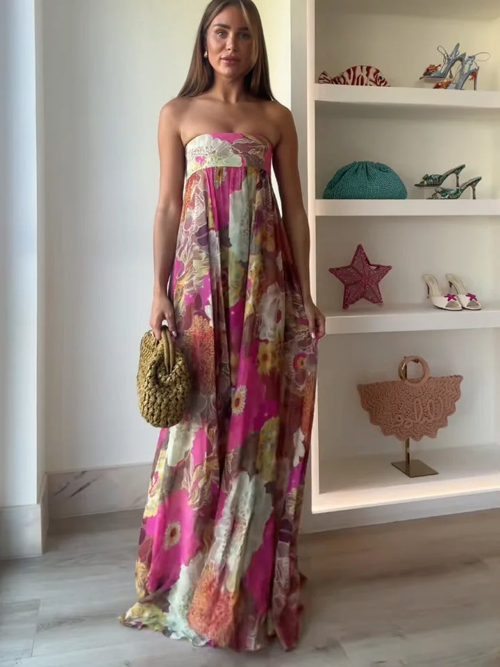Women's floral strapless maxi dress, elegant for wedding guests & formal occasions.