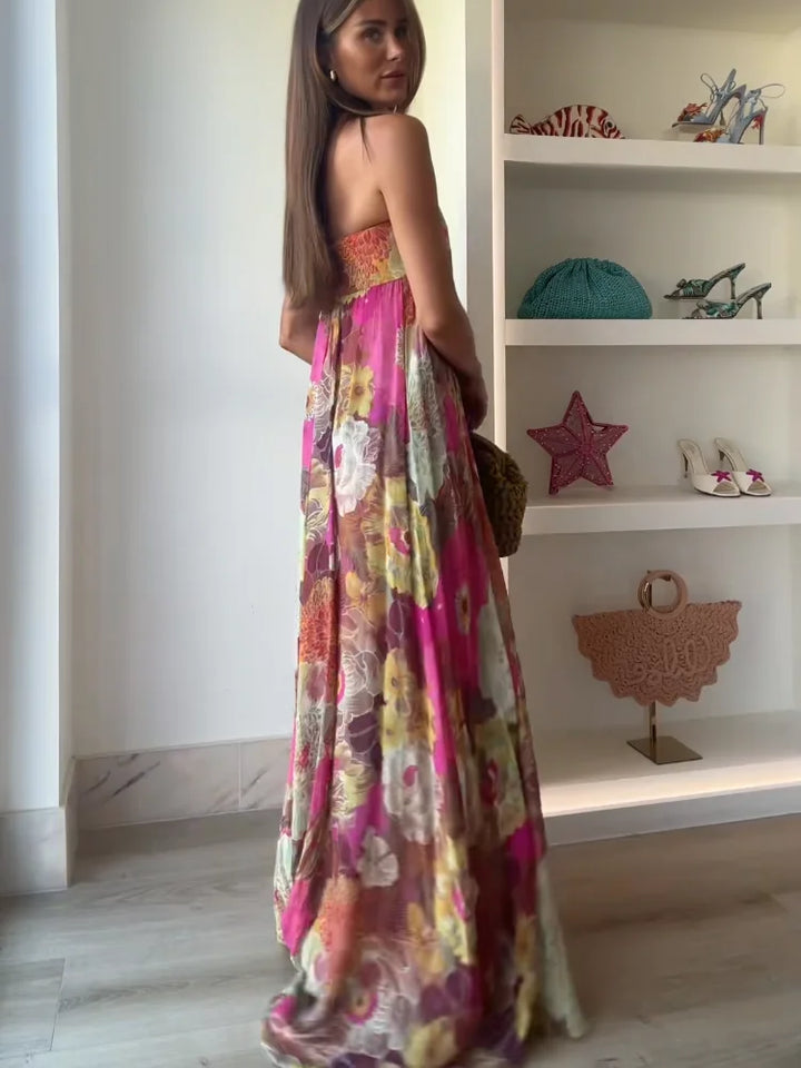 Flowy women's strapless maxi dress with beautiful floral print, suited for wedding guests & formal summer wear.
