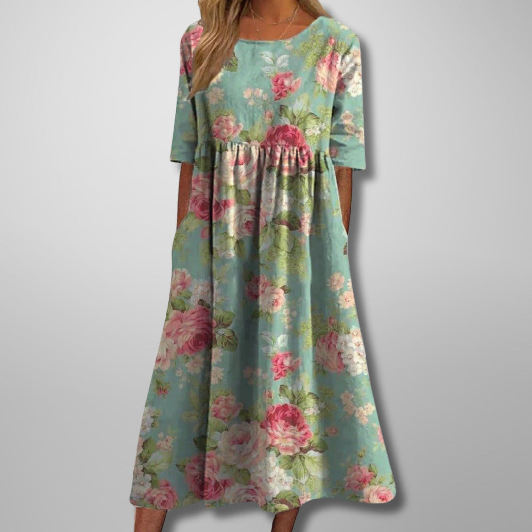Elegant women's floral maxi dress for summer, featuring a square neck and convenient pockets, perfect for vacation.