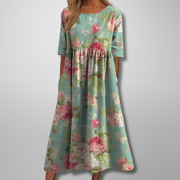 Elegant women's floral maxi dress for summer, featuring a square neck and convenient pockets, perfect for vacation.