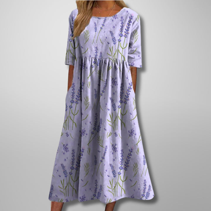 Bohemian floral summer maxi dress for women, designed with a flattering empire waist, 3/4 sleeves, and practical pockets.