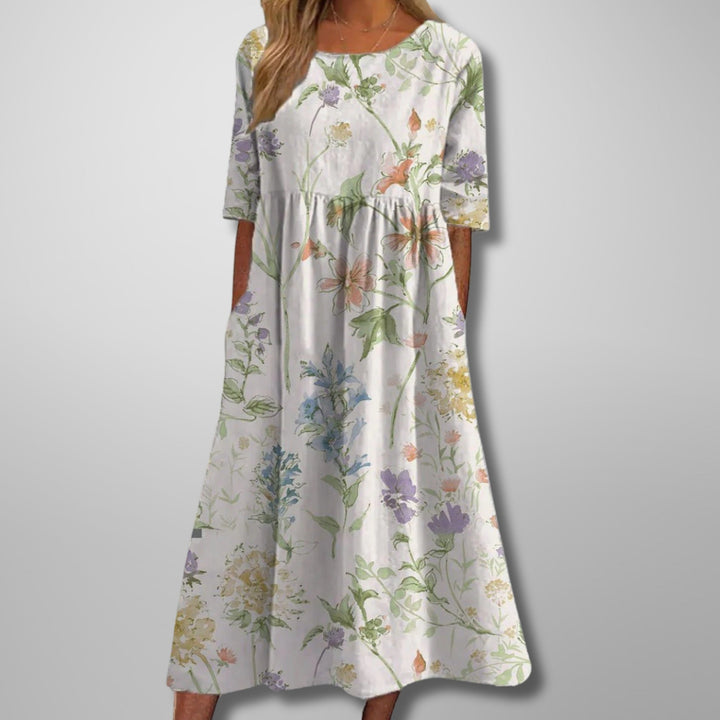 Casual women's floral summer maxi dress, comfortable with a square neck, 3/4 sleeves, and essential side pockets.