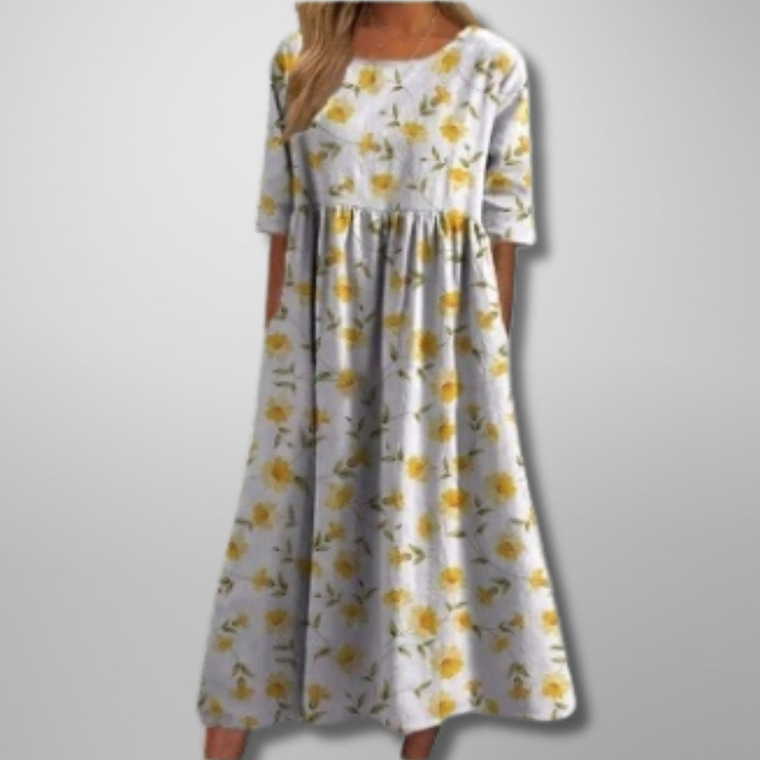 Women's square neck floral print maxi dress, 3/4 sleeves, empire waist, and pockets, ideal for summer fashion.