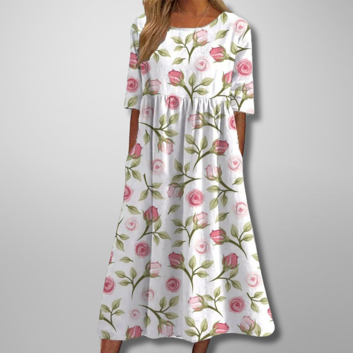Elegant women's floral maxi dress with practical pockets, a square neck, and 3/4 sleeves for summer.