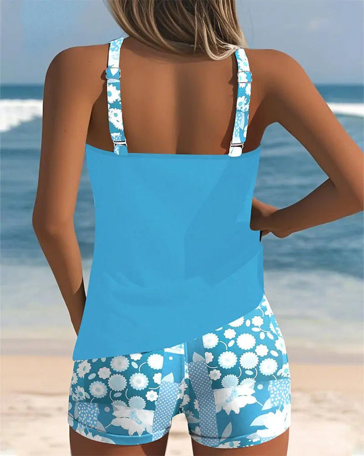 Women's floral tankini, modest swim shorts set, two-piece beachwear, comfortable summer fashion.