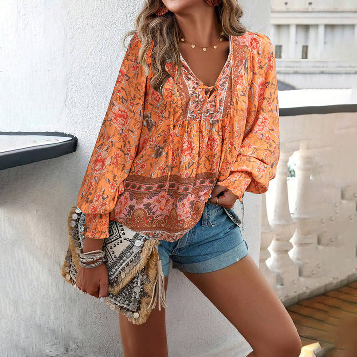 Stay stylish and comfortable in this women's floral tie front blouse for any casual occasion.