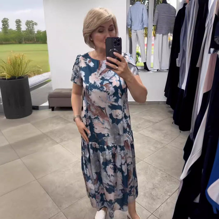 Comfortable women's floral tiered maxi dress in a flowy design, ideal for effortless summer style and vacation.
