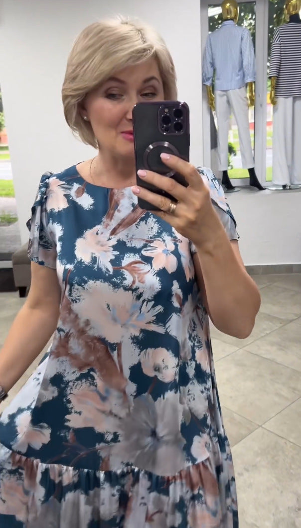 Elegant women's floral print tiered maxi dress, ideal for spring and summer, offering comfort and flowy style.