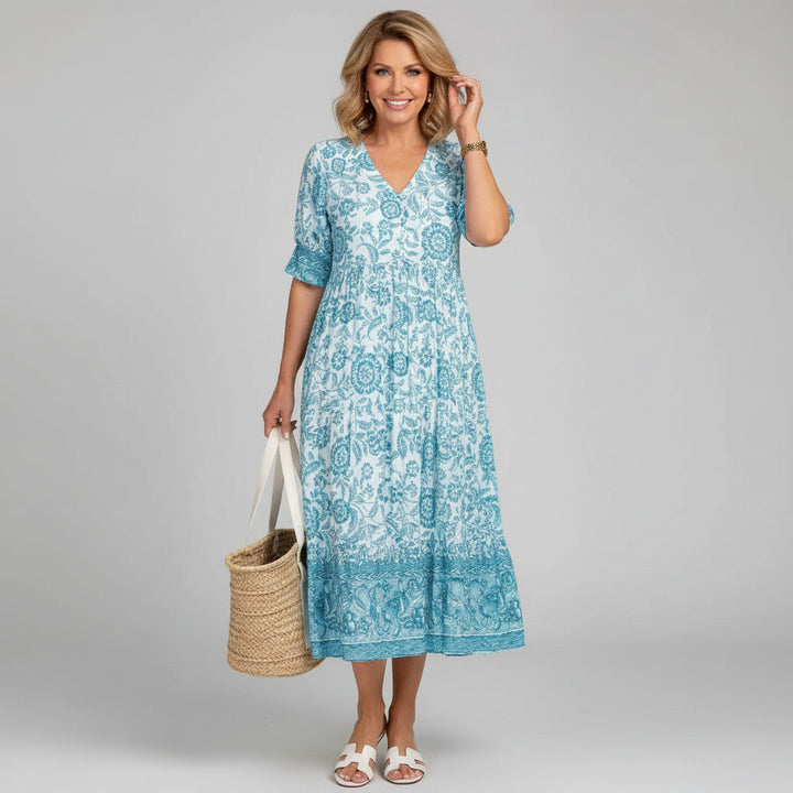 Chic women's floral tiered midi dress, versatile resort wear