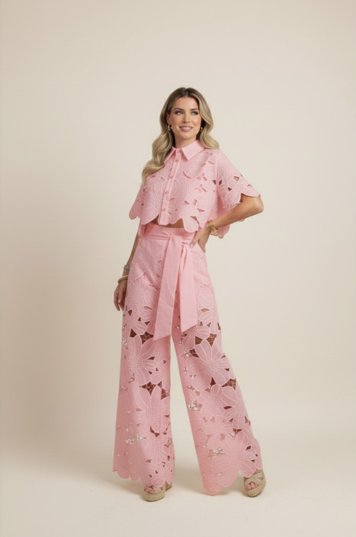Women's wide-leg floral pants and matching embroidered top, perfect for a chic summer outfit.