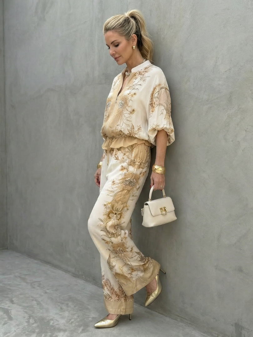 Elegant women's floral co-ord set featuring a vibrant baroque print and comfortable wide-leg pants. Smart casual.