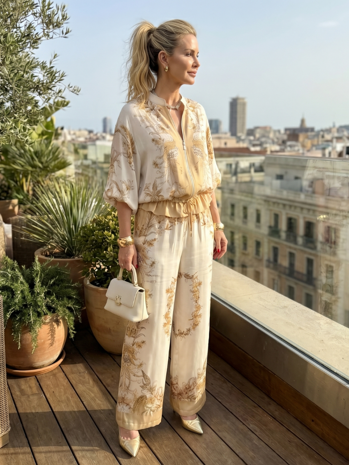 Stylish women's floral co-ord set. Relaxed fit top and wide-leg pants in a satin effect baroque print. Summer fashion.