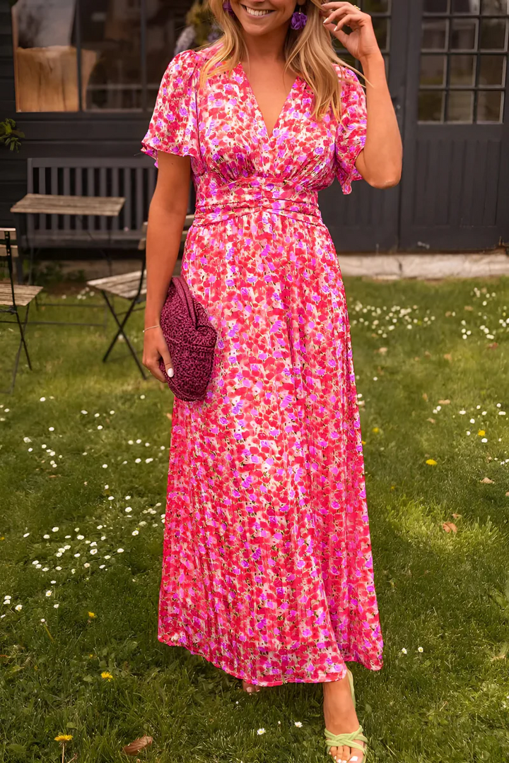 Beautiful floral wrap maxi dress with a V-neck and flutter sleeves, a chic choice for wedding guests.