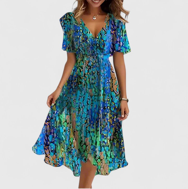Women's floral V-neck midi dress for summer. Effortless style, perfect for casual or elegant occasions.