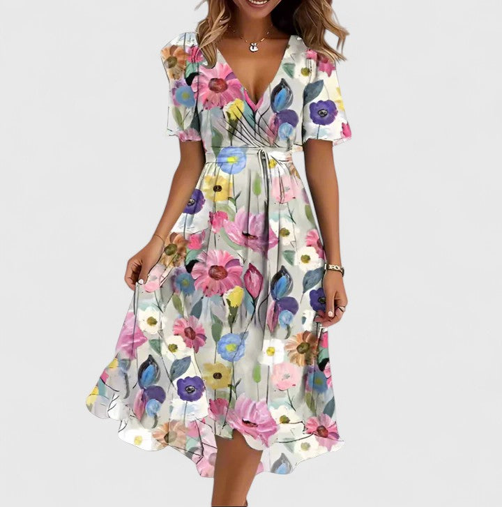 Elegant V-neck floral midi dress for women, with a flowing silhouette. Perfect summer fashion statement.