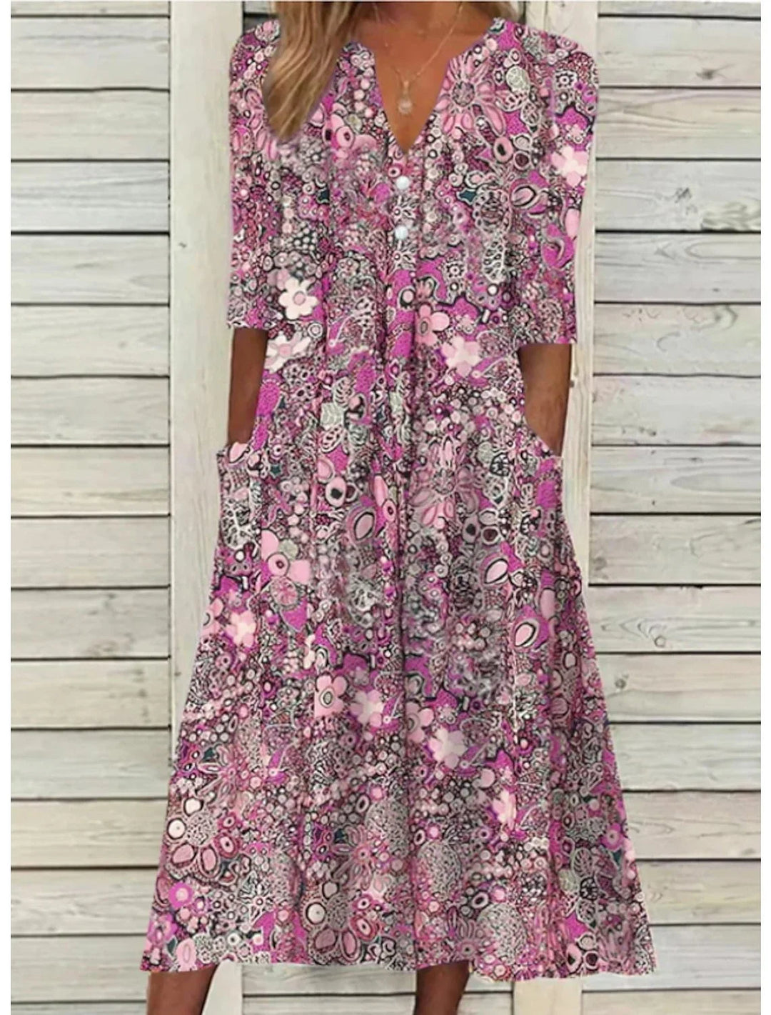 Elegant women's floral V-neck midi dress with 3/4 sleeves, side pockets & relaxed fit. Stylish.