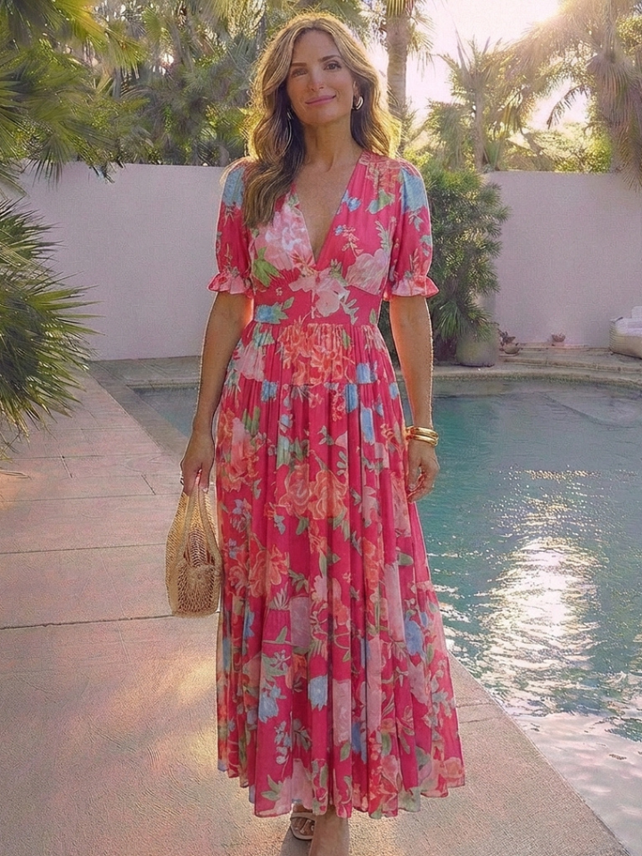 Vibrant floral print midi dress for women, designed with a flattering V-neck and delicate flutter sleeves.
