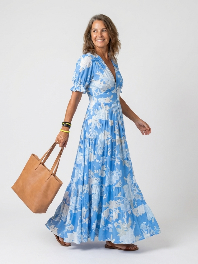 Women's elegant V-neck floral midi dress with stylish flutter sleeves, perfect for a spring or summer event.