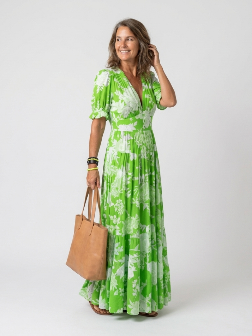 Flowy women's floral V-neck midi dress with flutter sleeves, a versatile piece for casual or vacation wear.