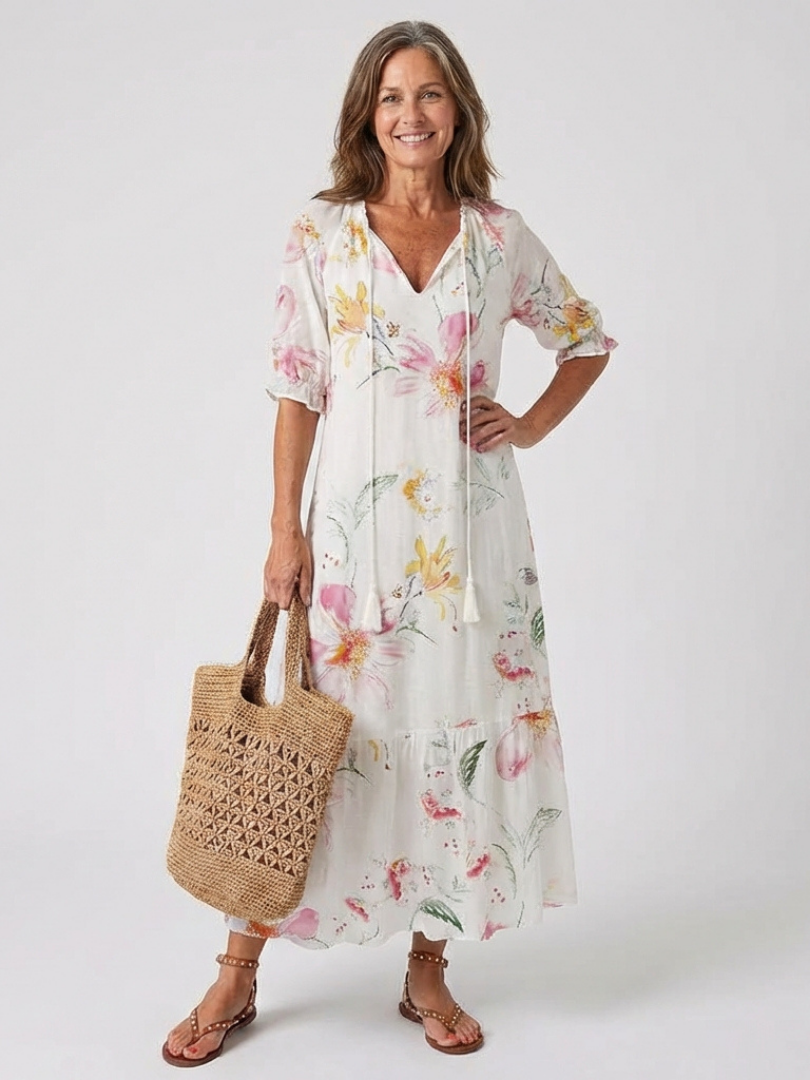 Stylish women's floral print V-neck midi dress. Short sleeve, relaxed fit, ideal for summer fashion.