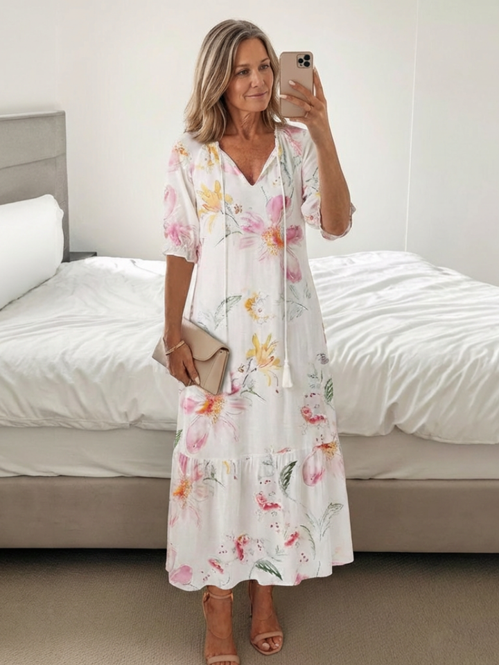 Effortless women's floral midi dress with V-neck & short sleeves. Comfortable casual summer fashion.