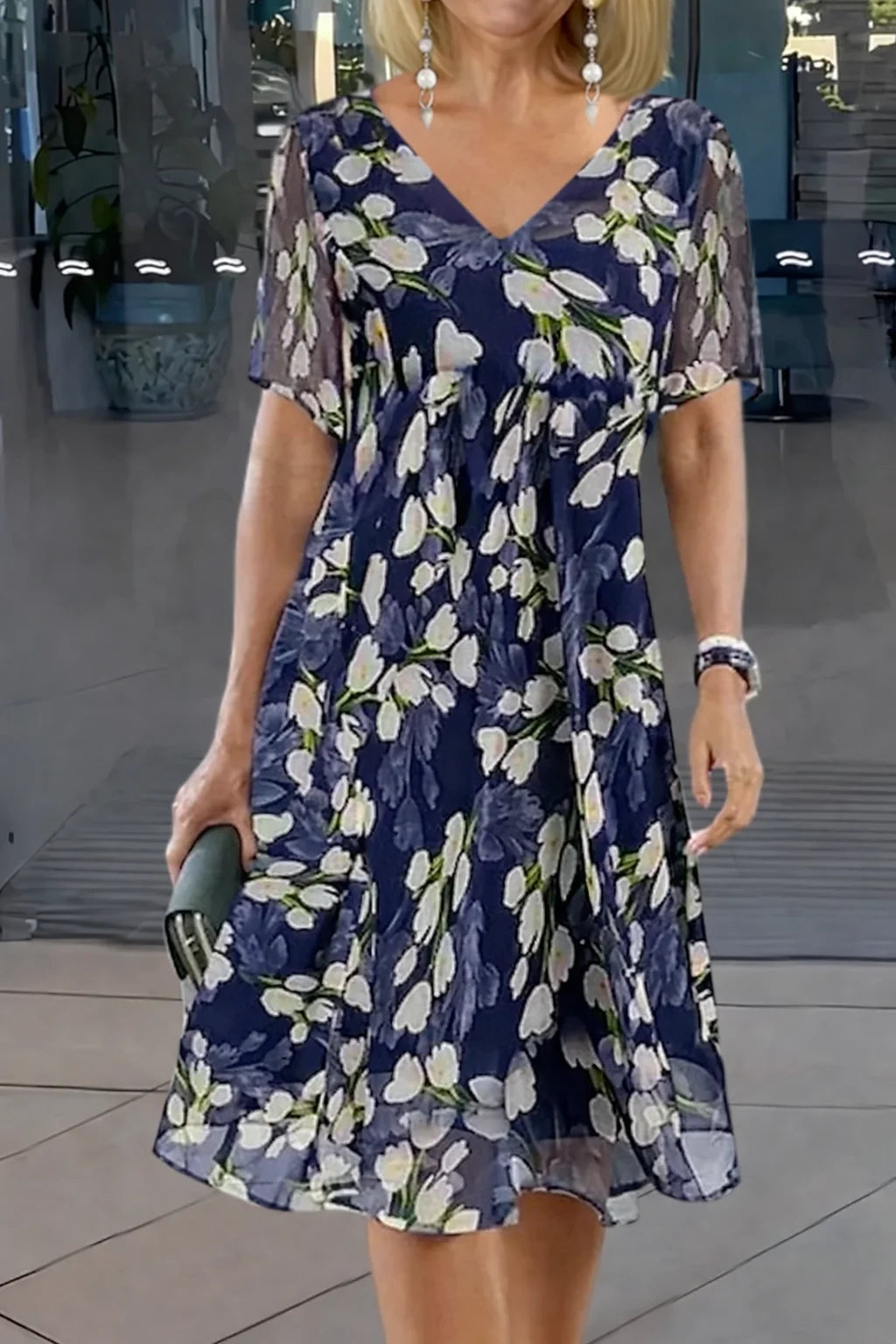 Women's floral V-neck mini dress with short sleeves, perfect for summer casual wear.