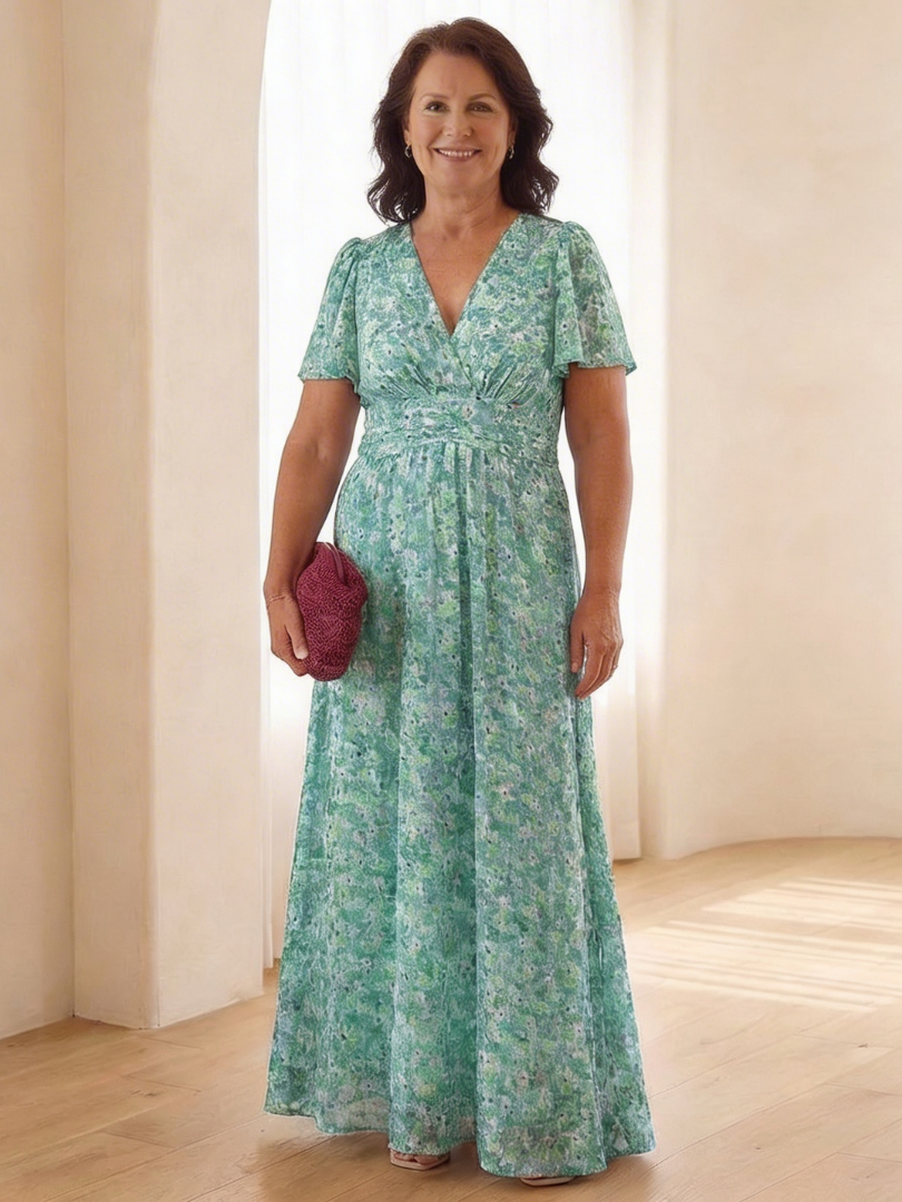 Relaxed fit flowing floral maxi dress for women, featuring a V-neckline and short sleeves.