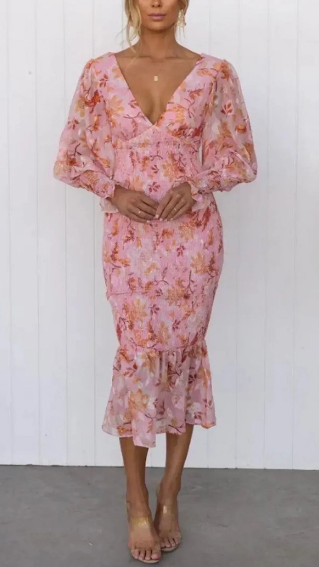 Women's floral wrap midi dress, perfect for wedding guests. Features elegant V-neck & puff sleeves.