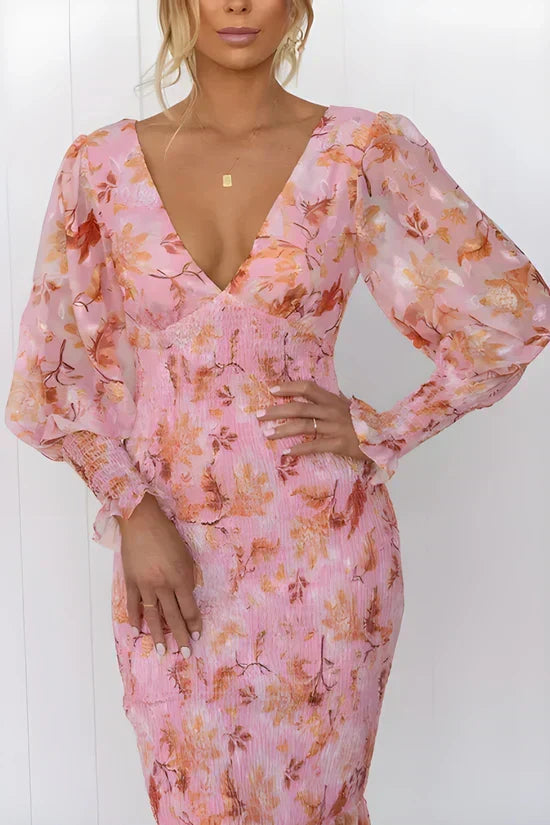 Chic women's V-neck floral midi wrap dress with puff sleeves, ideal elegant occasion wear or party dress.