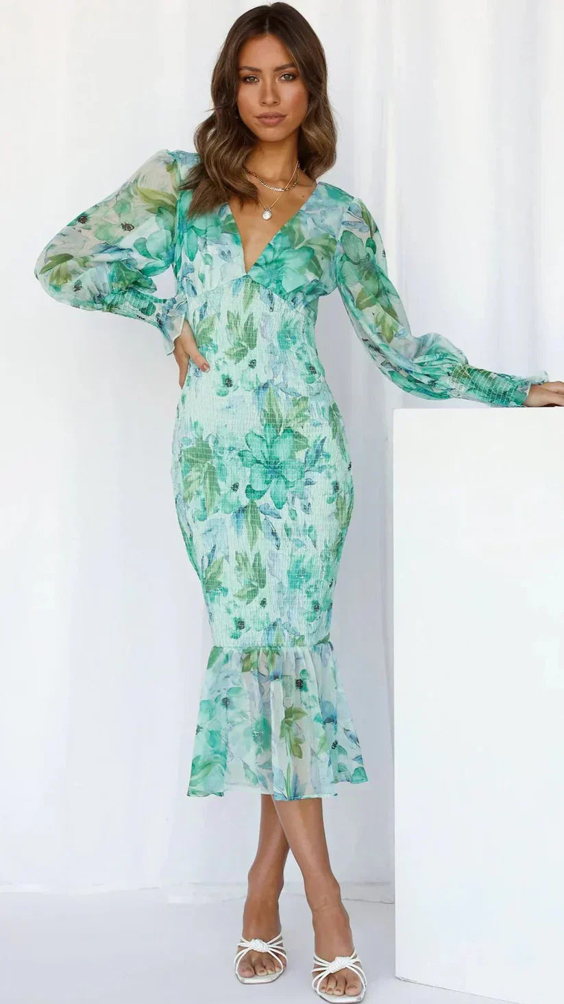 Women's elegant floral midi wrap dress featuring a V-neck, puff sleeves, and a flattering silhouette for occasions.