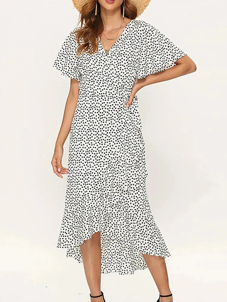 Elegant women's floral summer midi wrap dress. V-neck, flutter sleeves. Ideal for beachwear & casual style.