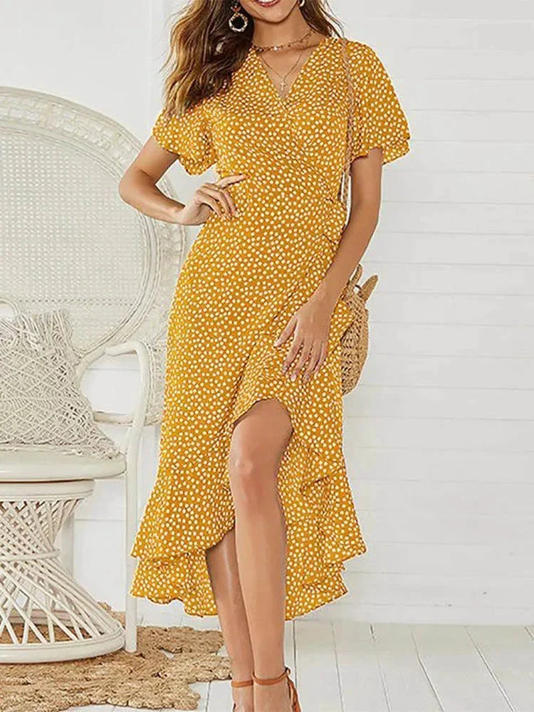 Vibrant floral women's midi wrap dress for summer. Features V-neck, flutter sleeves, & adjustable tie waist.