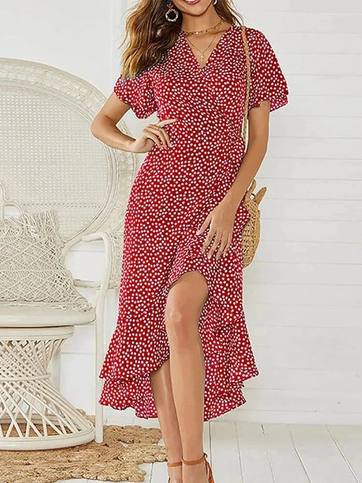 Boho-chic women's floral print midi wrap dress. Ideal summer dress with V-neck, flutter sleeves & tie waist.
